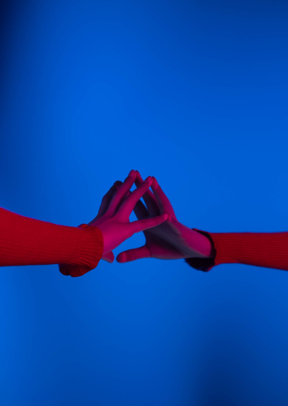 hand touching reflection on mirror